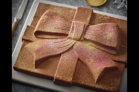 Morrisons' M Signature large chocolate present with glitter: Belgian chocolate mousse with a hidden caremelised orange sauce on a solid chcolate base with honeycomb pieces.